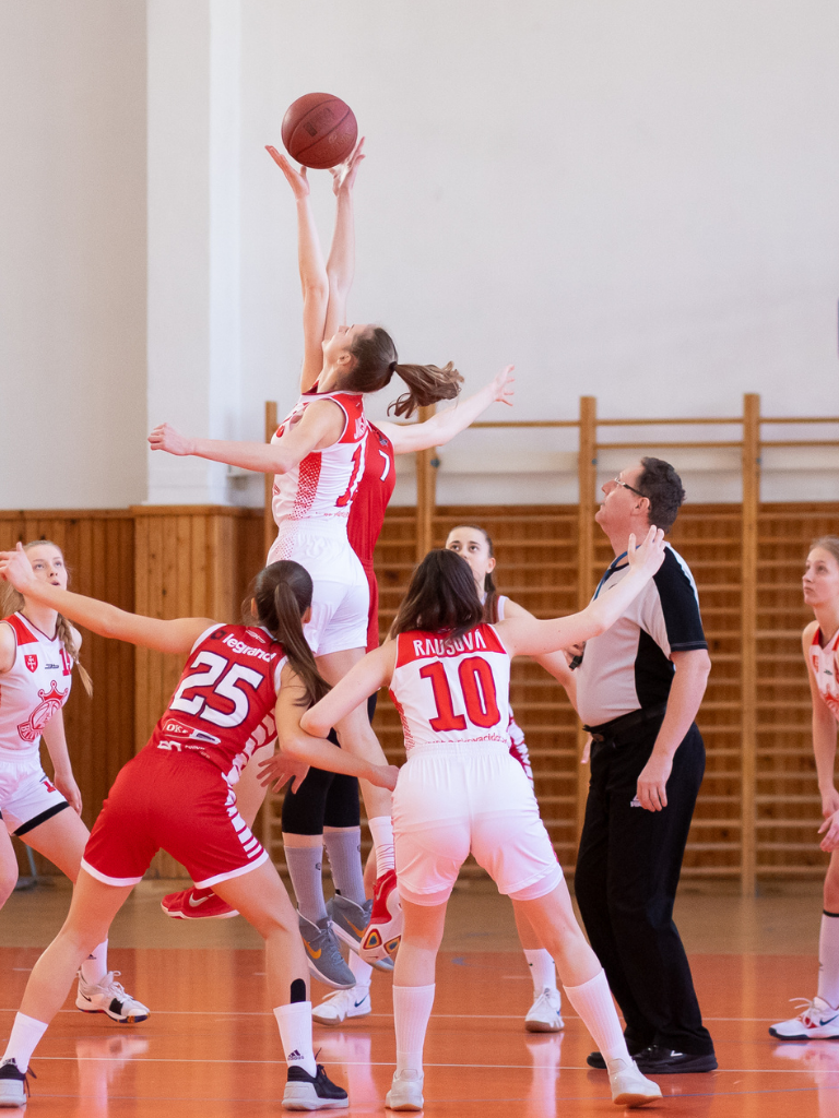 young-men-playing-basketball-in-red-and-white-dresses